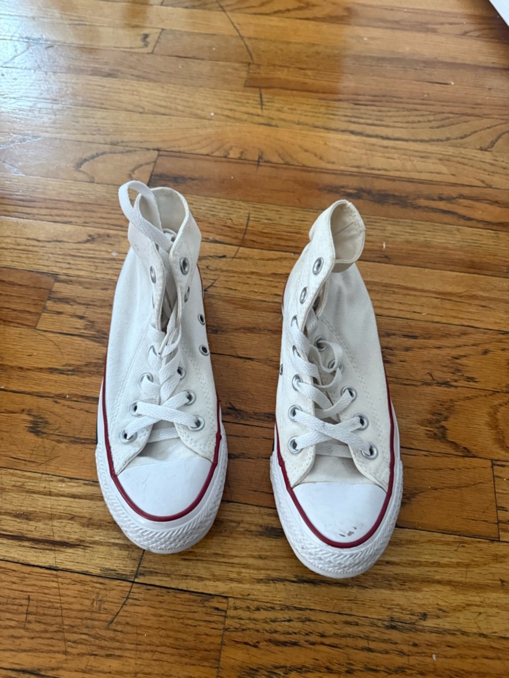 Classic White High-Top Converse Sneakers with Red Stripe